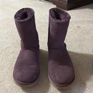 Woman’s purple Ugg boots